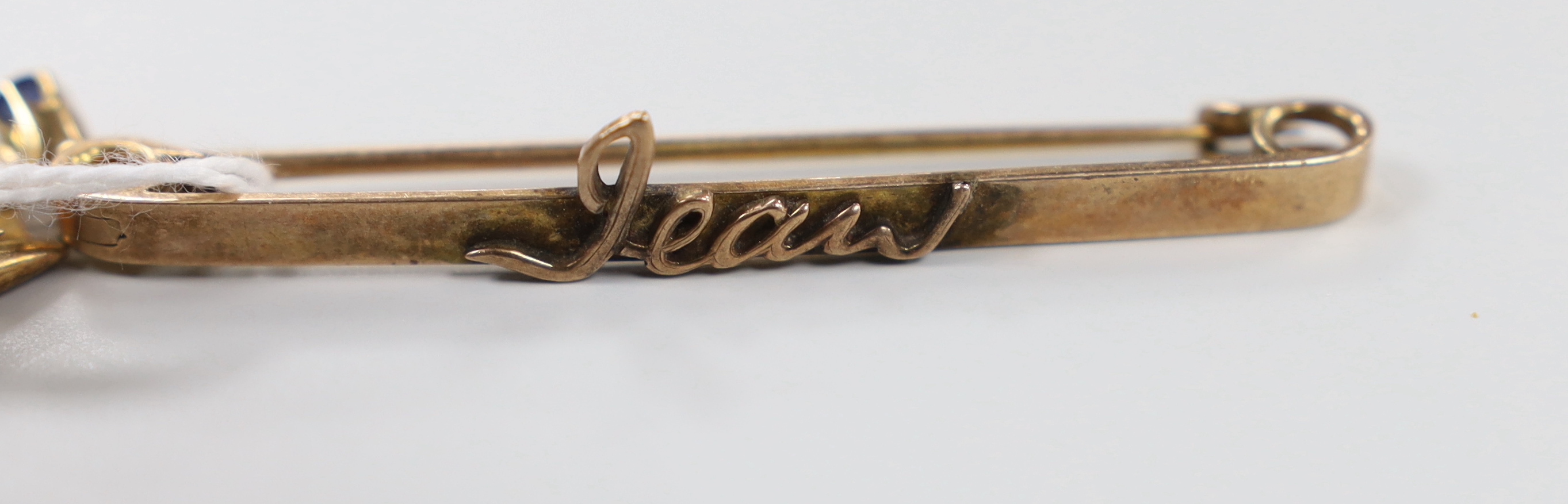 An Edwardian 15ct, ruby and diamond set bar brooch, 48mm, gross weight 3.3 grams, a similar yellow metal, sapphire and diamond cluster set bar brooch and two 9ct bar brooches, gross weight 9.3 grams.